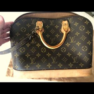 Authentic Louis Vuitton Alma Handbag with dust bag. Used. See pics for condition